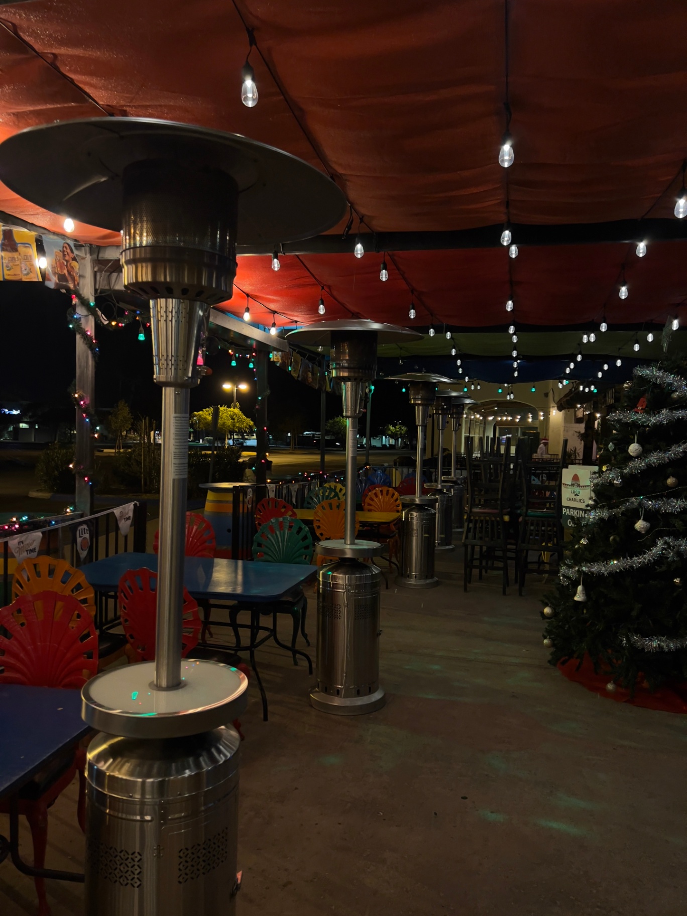 Evening reception with heaters, candles and floral centerpieces